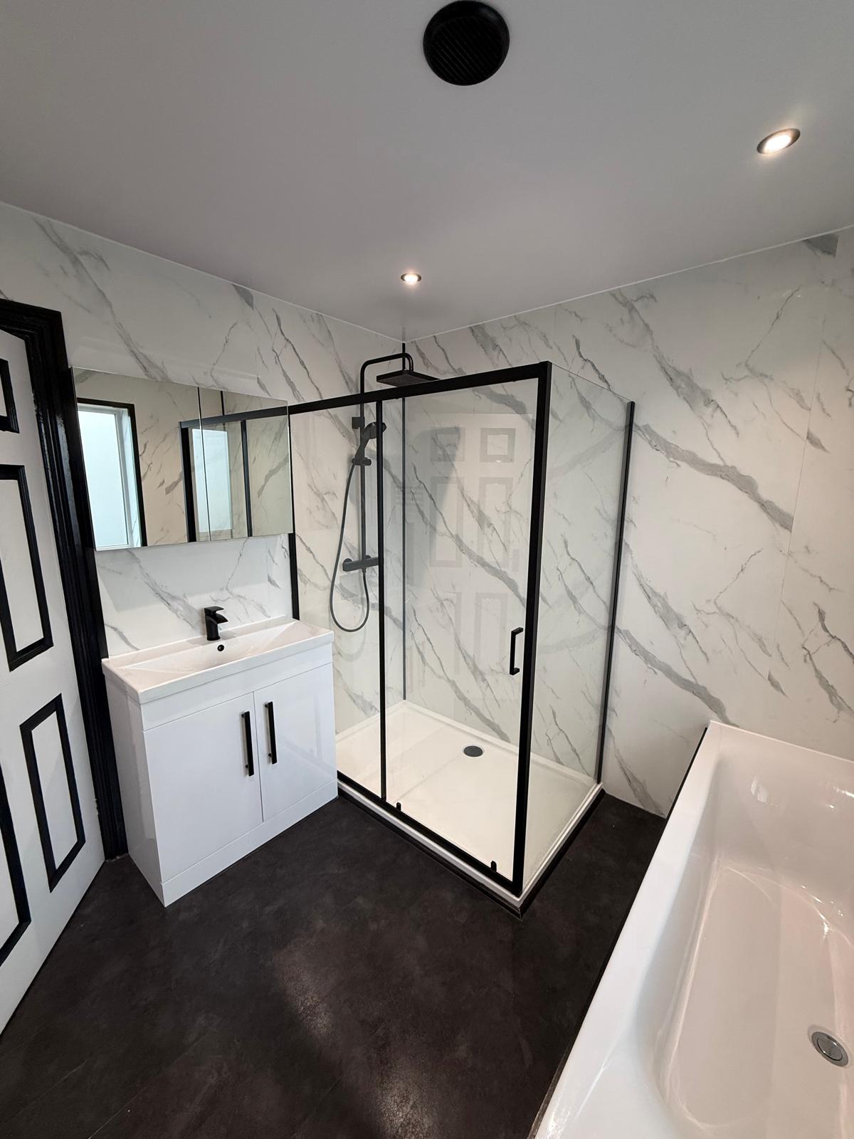 Refreshed bathroom with marble-effect PVC panels in Kinmel Bay, North Wales